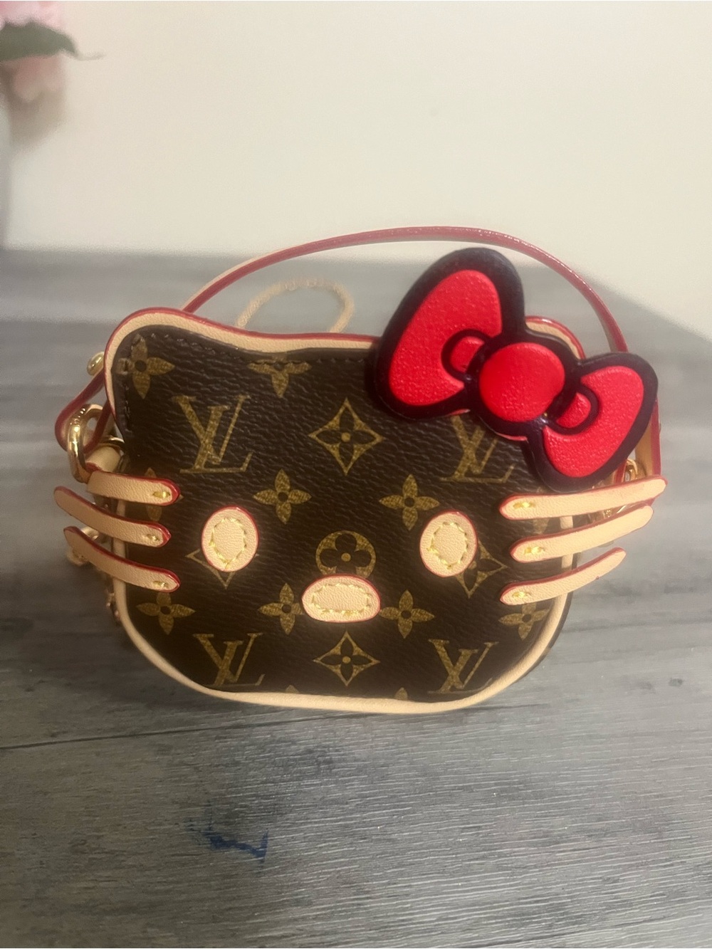 Hello Kitty Brown Monogram Crossbody Bag with Red Bow